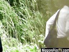 Adorable Japanse Student With Braids Pees In The Breeze
