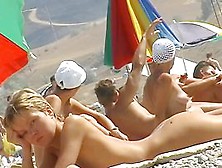 Sexy Blond Chicks Sunbathing On A Nude Beach