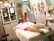 Adorable Asian Girl Lies On The Massage Table And Is Made T