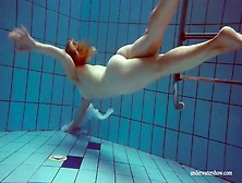 Redhead Goes For A Nude Swim In The Pool