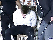 Muscular Guy On His Knees With Arms Tied Back Receiving Flogging In An Intense Interrogation