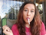 Cute Girl In Red T-Shirt Smoking White Filter 100 Cigarette Hands Free