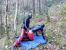 Home-Made Masked Latex Rubber Doll Lovers Fuck Outdoors In Forest