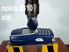 Hydraulic Press Against Mature And New Nokia 3310