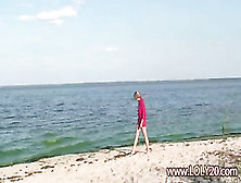 Shy Nude Girl On The Beach