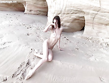 Slender Teenager Black-Haired Is Posing Naked Near The Rocks And Opening Up Up Broad To Demonstrate Her Vag