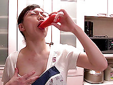 A Horny Japanese Milf Fucks Some Food On The Kitchen Floor