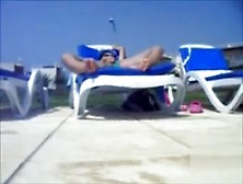 My Wife In Lounge Chair Stimulates Her Clitoris Poolside