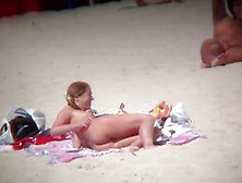 Two Busty Friends Are Relaxing On A Nudist Beach