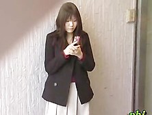 Feisty Young Japanese Slut Holding Her Phone During Sharking Adventure