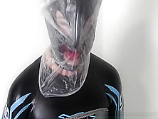 Tied Wife In Neoprene Suffers With A Plastic Bag