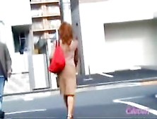 Redhead Babe Got Skirt Sharked And Her Butt Peeped A Bit
