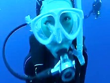 Cute Scuba Diving Woman Floating And Smiling Underwater
