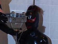 Latex Mistress Pours Some Yuck In Her Slave Throat
