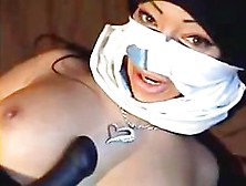 Masked Arabic Lady Plays With A Big Black Dildo On Tape