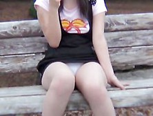 Upskirt And Downblouse Of Girl Eating Ice Cream On The Bench