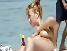 Oiling Tits On Topless Beach