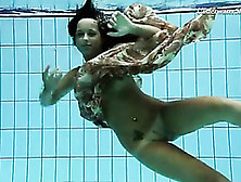 Brunette Swims In Her Dress And Strips