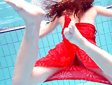 Crimson Clad Teen Swimming With Her Eyes Opened