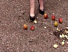 Crush Fetish Outdoors.  Fat Legs In High Heel Shoes Crush Apples.