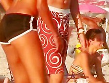 A Voyeur Is Filming A Game Of Volleyball On Beach
