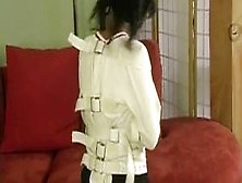 Angry Girl Struggles In A Straitjacket