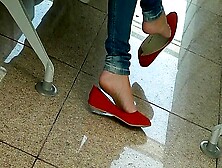 Amateur Beauty Dangles Her Red Flat Shoes In Public