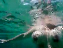 German Woman Swimming With Tampon