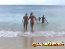 Naked Teens Lotion Up At The Beach