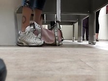 Female Feet And Shoes In The Public Toilet