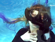 Elise Diving In Wetsuit