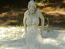Woman In Swimsuit Having Fun In Mud