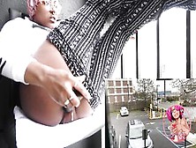 Black Screws Herself On Hotel Balcony Ontop Of Parking Lot