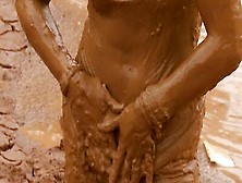 Dirty Girl Is Rubbing Some Mud All Over Her Body