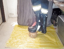 Firefighter Stomping A Cake With Haix