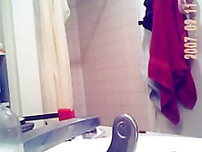 Voyeur Captures A Hot Brunette Naked In The Bathroom