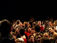 Naked People Climbing Over Audience