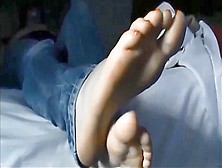 She Shows Us Her Feet And Lets Glimpse Her Body