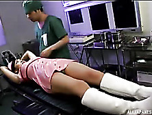 Japanese Nurse In Sexy Pink Latex Uniform Lets A Handsome Doctor Tie Her On A Black Bed Then Straps Her Mouth With A Black Ball