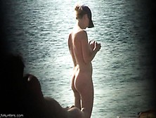 A Voyeur Secretly Records A Hot Lady Naked On A Beach