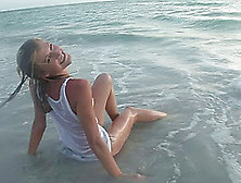 Amateur Blonde Teen Naively Poses In Wet T-Shirt On The Beach