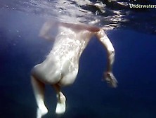 Sexy Babe Swimming Gracefully Naked Underwater