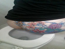 Tattooed Babe Shitting In Toilet