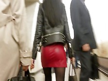 Sexy Brunete S Ass In Red Leather Skirt
