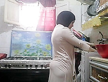 Routine Hijab Arabic Muslim In Kitchen