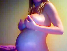 Blonde Milf Displays Her Very Pregnant Belly And Big Boobies To Her Webcam Viewers.