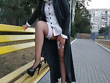 Lady Walking In The Park In A Raincoat And African Fishnet Stockings With A White Elastic Band