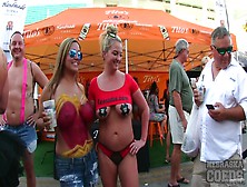Body Painted Beauties Playing At A Street Fair