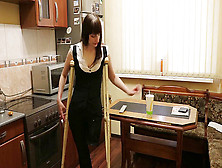 Amputee Teasing With Nylons And Crutches