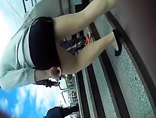 Spy Camera Follows A Sexy Long-Legged Woman In A Short Skir